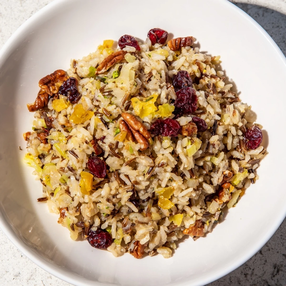Golden brown wild slow roasted rice and cranberry medley, perfect for a cozy fall dinner side dish.