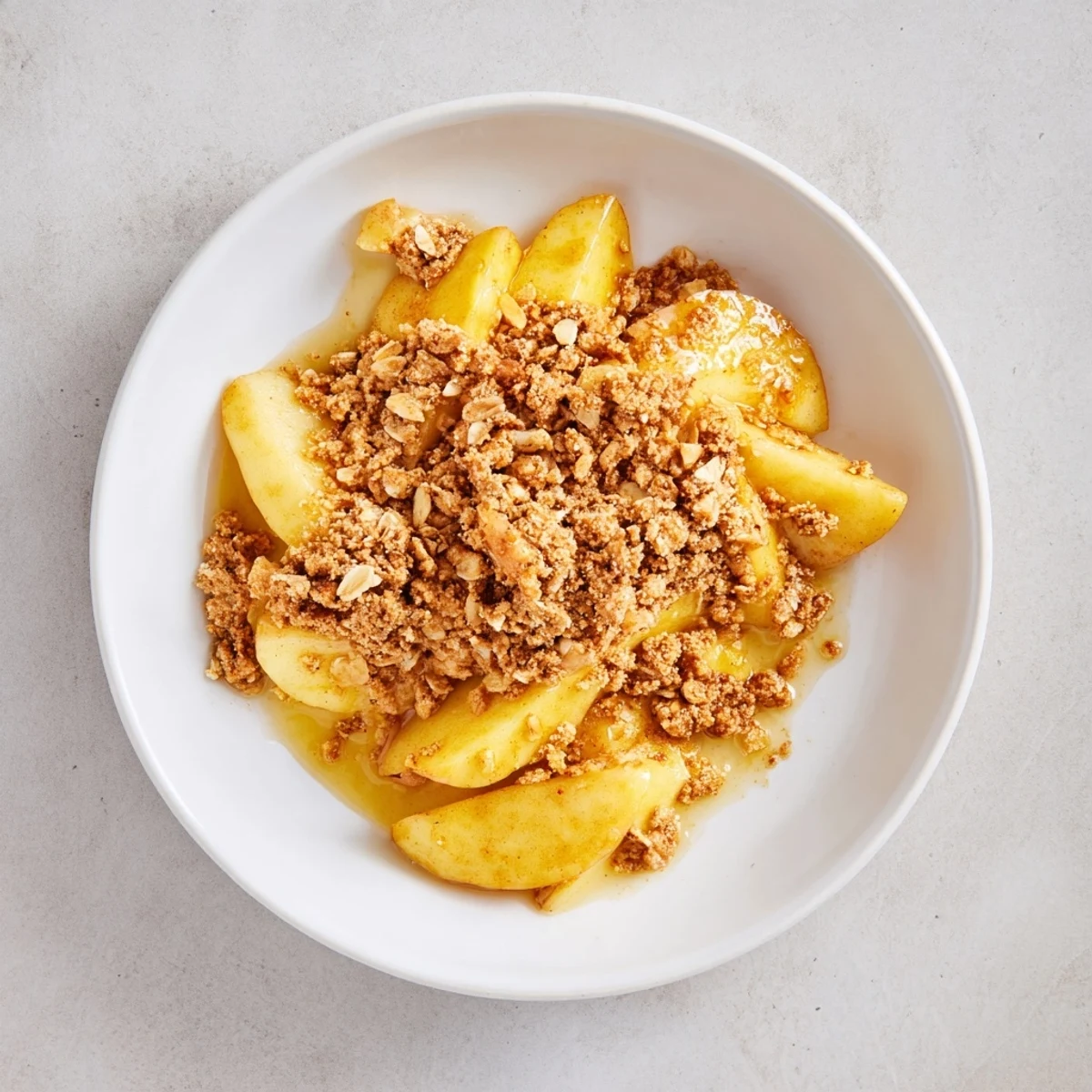 Golden Turmeric Maple Almond Crisp Apples, bubbling hot, ready to scoop and enjoy.