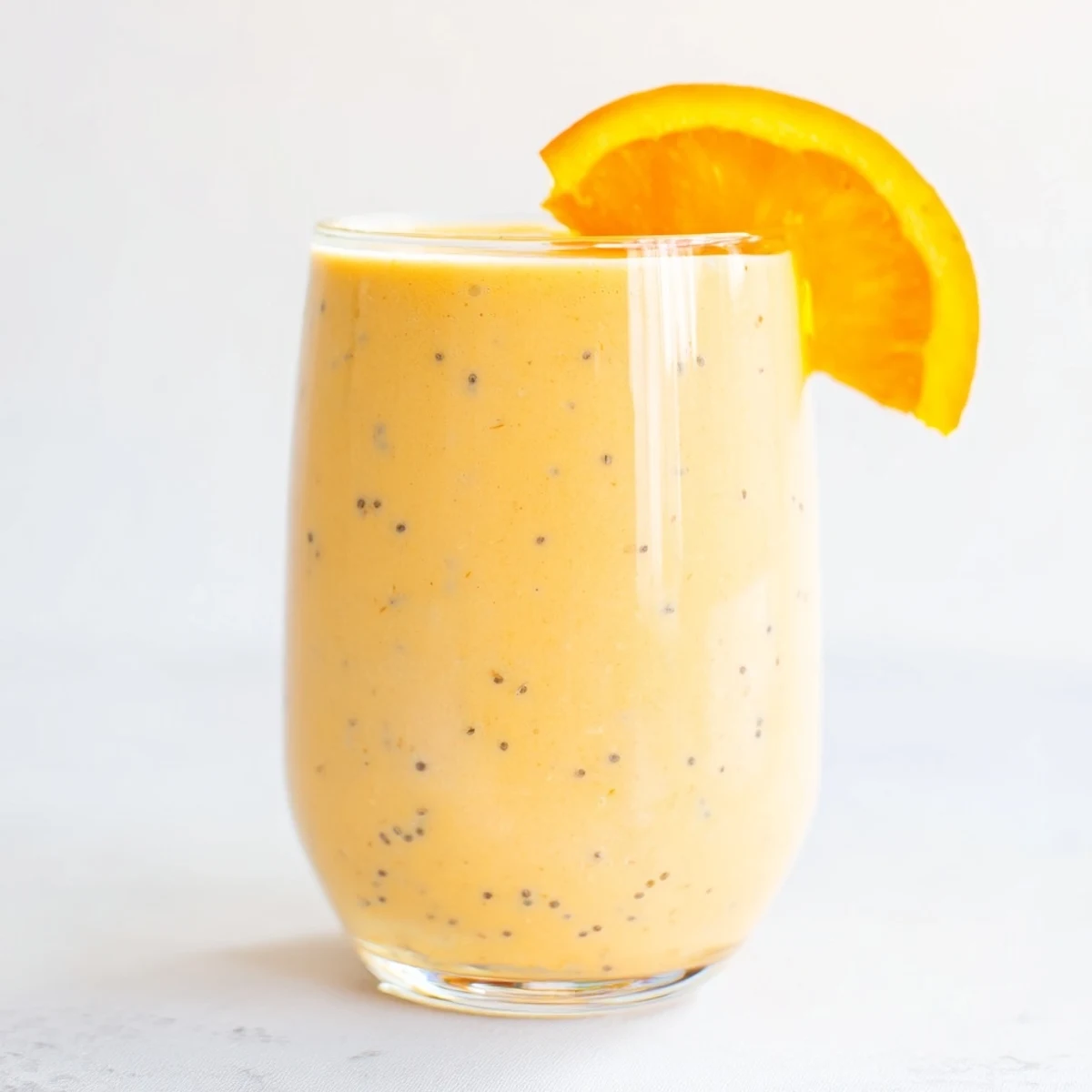 A beautifully blended Citrus Ginger Smoothie, showing a vibrant color and hints of fresh ginger.