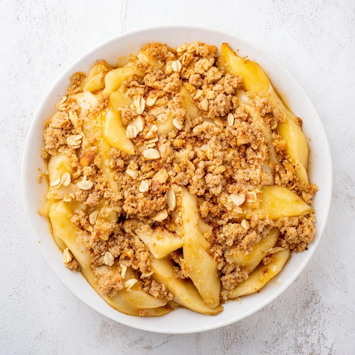 A close-up shot of homemade Pear Almond Crumble, its crunchy topping smells of cinnamon.