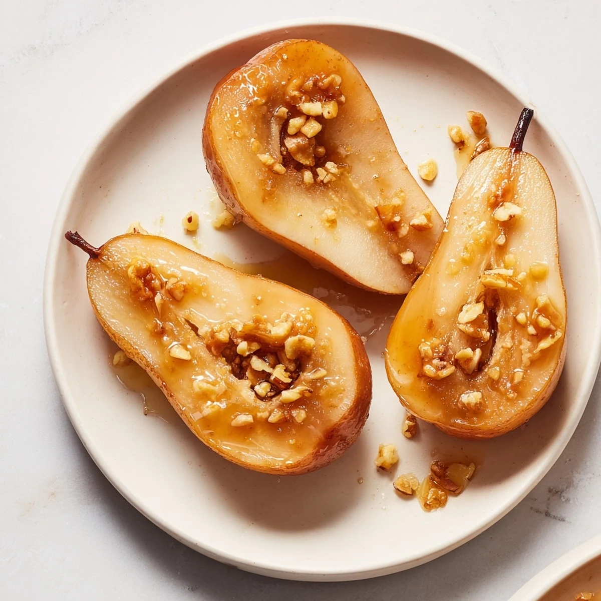 Ginger Baked Pears glistening with a warm glaze, a comforting dessert for any occasion.