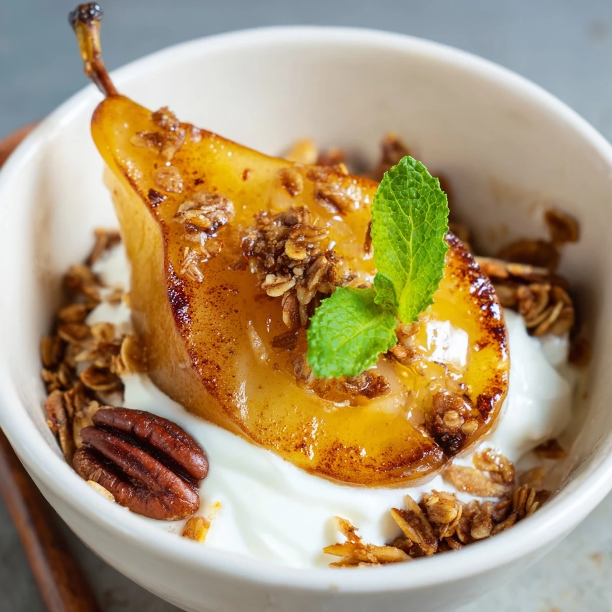 Roasted Pear Parfait is topped with a honey drizzle and toasted nuts for added texture.