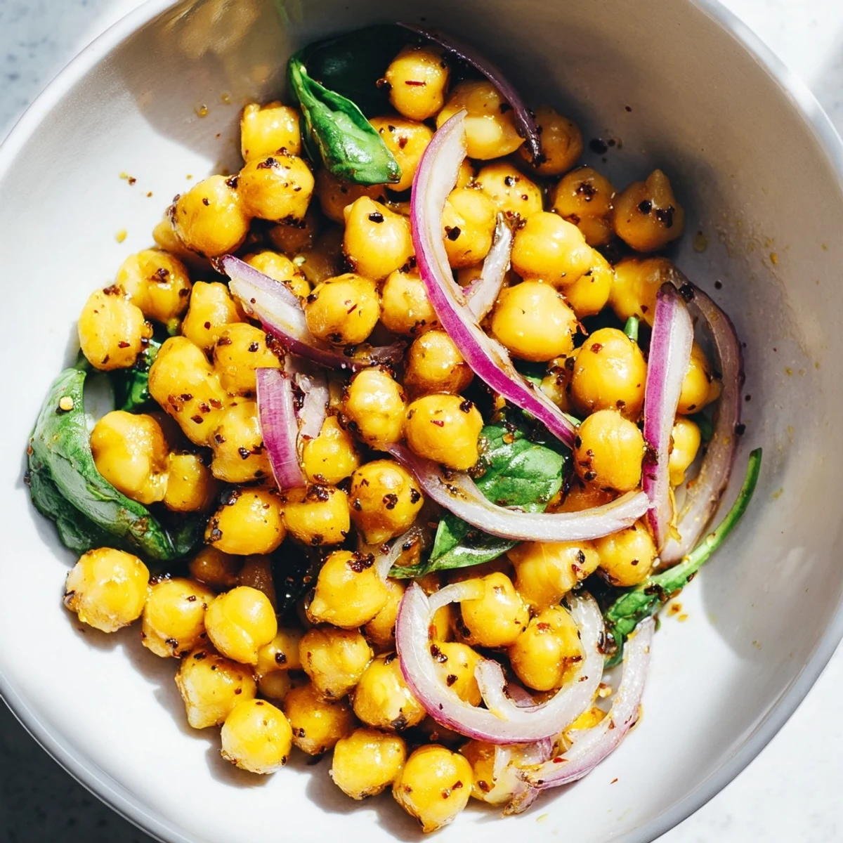 Golden Turmeric Chickpea Skillet with Honey Glaze served warm with lemon wedges and fresh cilantro garnish.