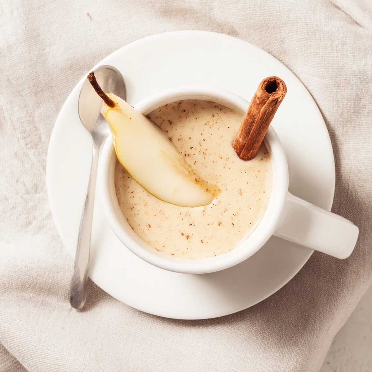 Warm spices and soft pear texture shine in this inviting Pear & Ginger Scented Cinnamon Warm Smoothie.