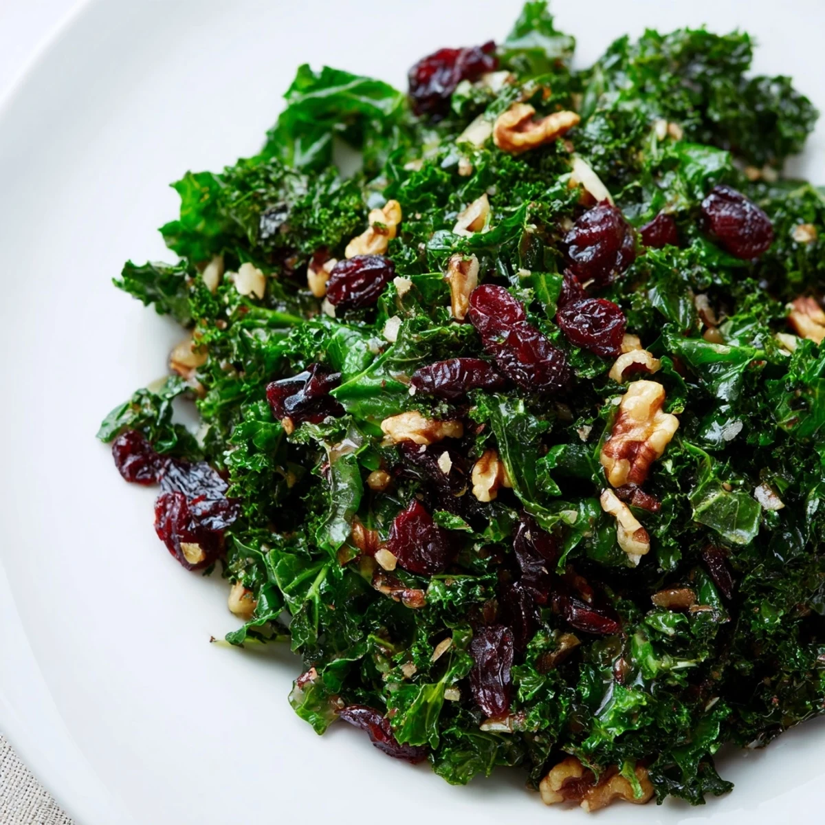 Vibrant Garlic Sautéed Kale with Cranberries tossed with sliced garlic and sweet-tart cranberries, ready to be served.