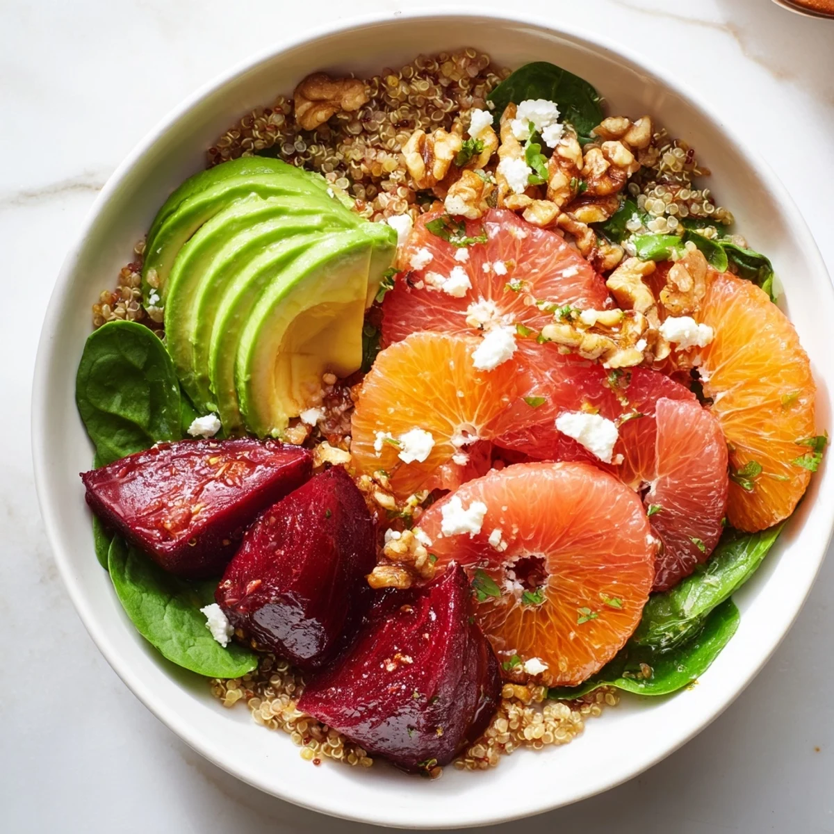Wholesome Roasted Beet and Citrus Grain Bowl served over greens with a zesty dressing drizzle.