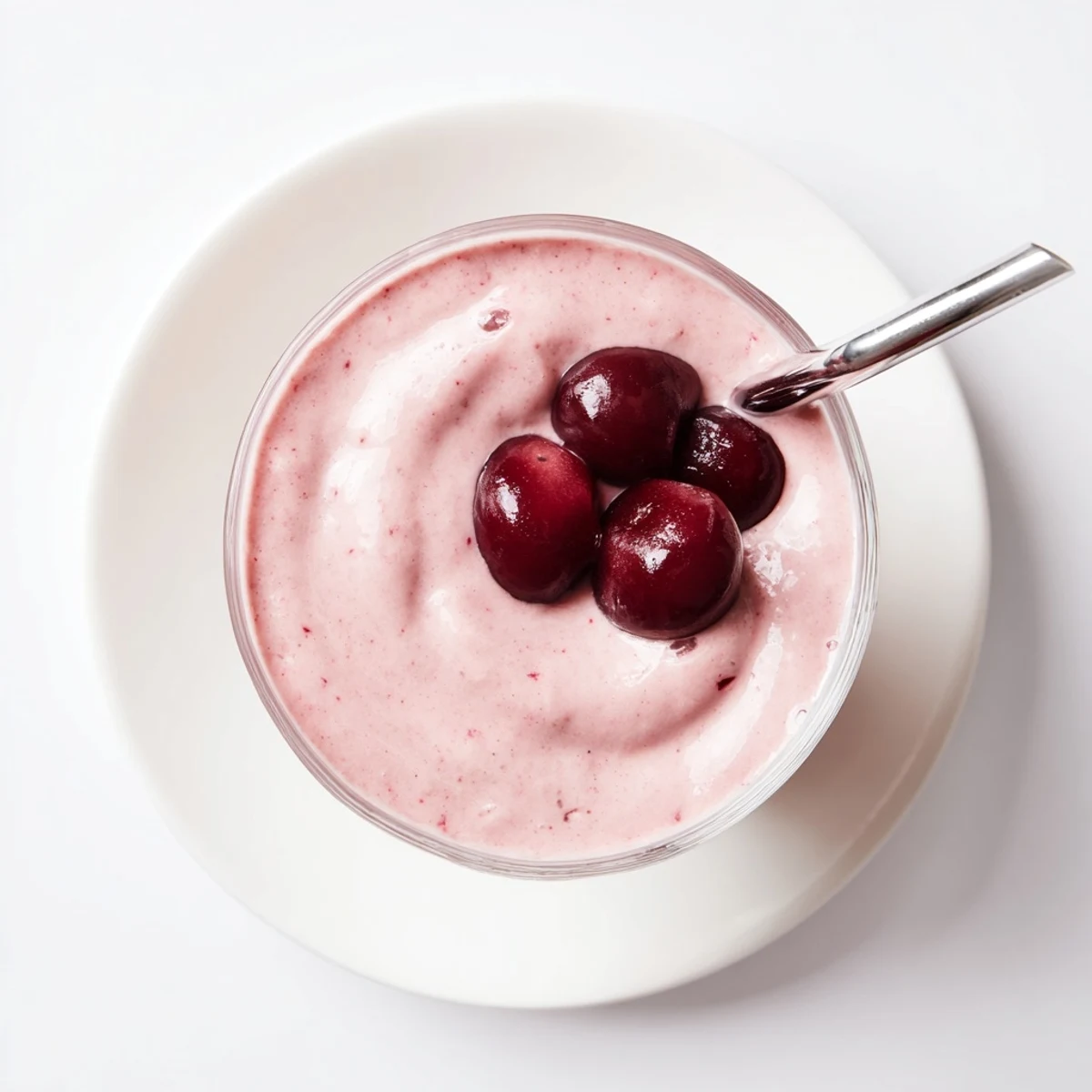 Healthy cherry vanilla protein smoothie garnished with fresh fruit perfect for breakfast or post-workout