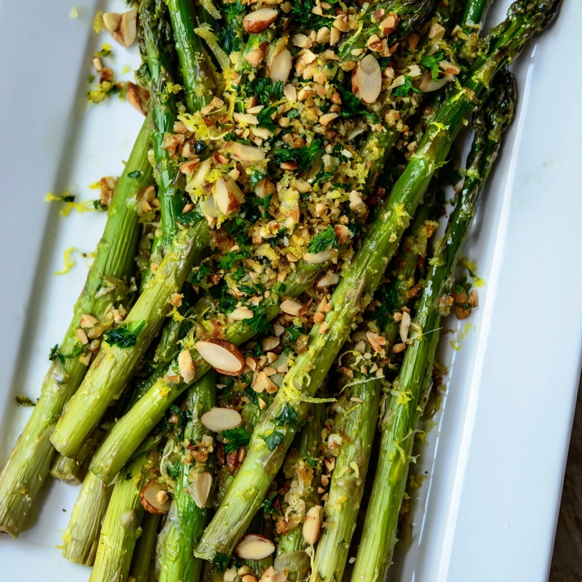 Tender Mediterranean roasted asparagus with lemon zest garlic almond gremolata garnish ready for spring dinner table