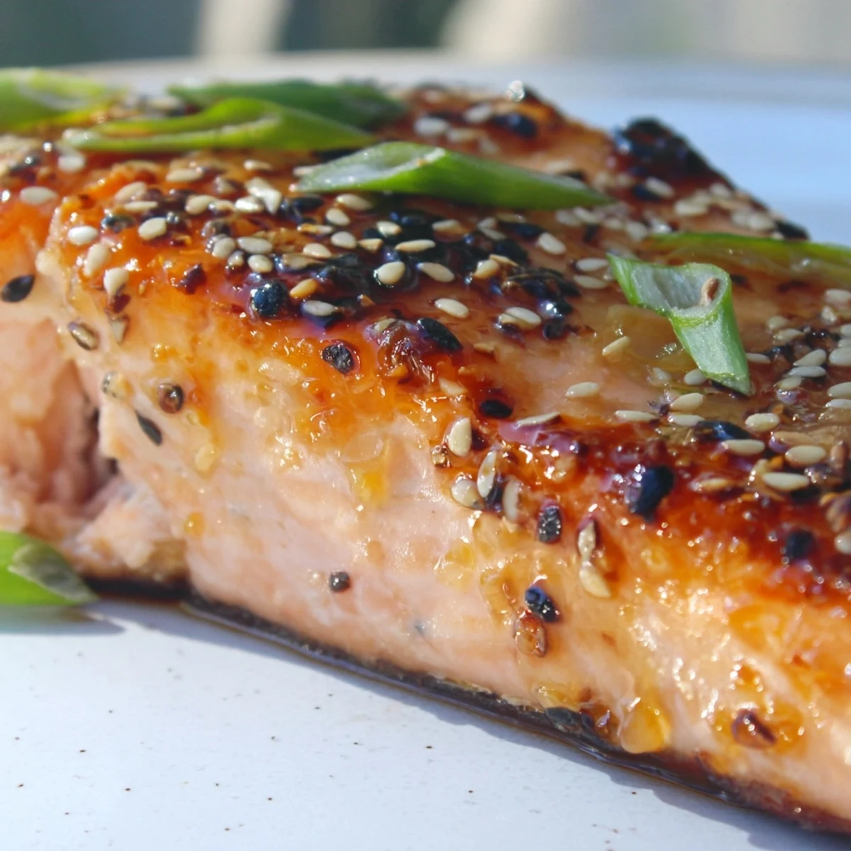 Golden baked citrus miso glazed salmon with caramelized edges and sesame seed topping