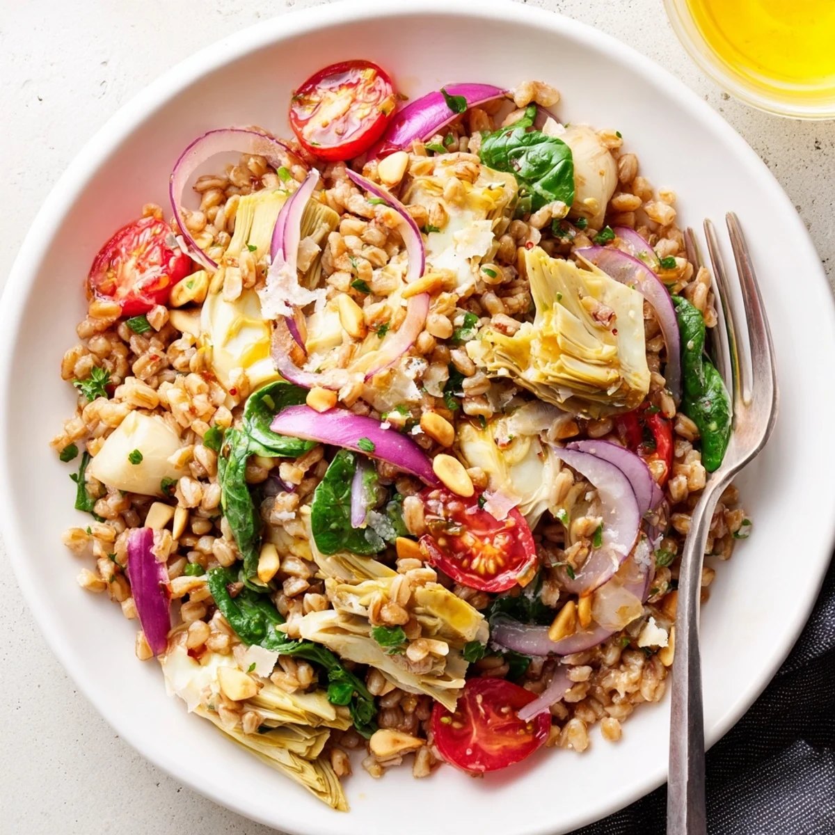 Warm Farro and Roasted Artichoke Salad with caramelized artichokes, lemony dressing