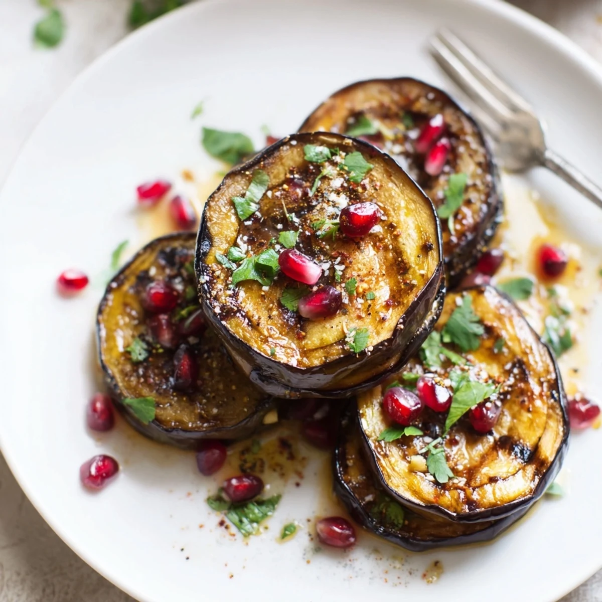 Smoky Roasted Eggplant Rounds on a platter, golden edges, parsley sprinkle.