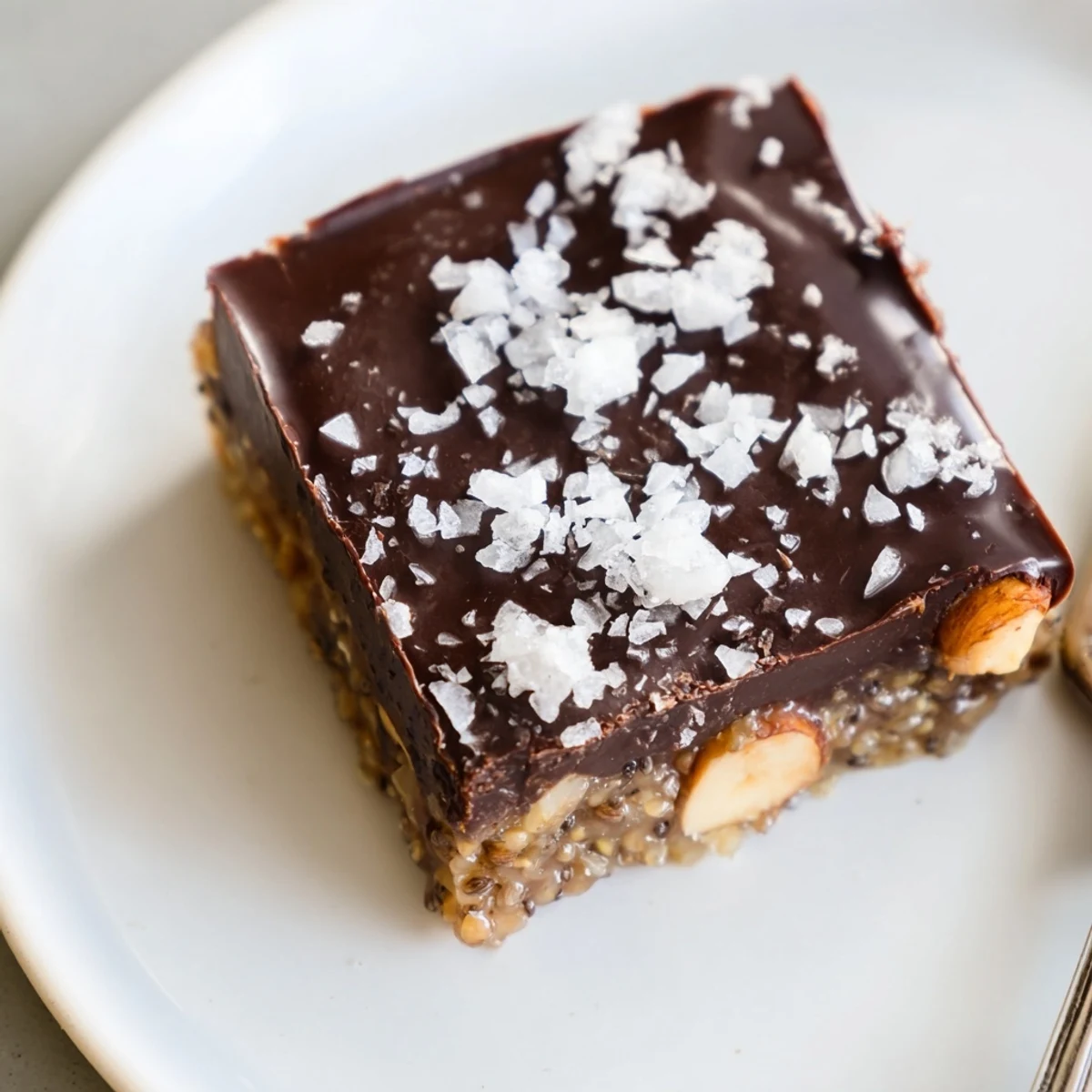 Cocoa Cashew Coconut Chia Indulgence sliced into squares, chewy coconut and chia texture