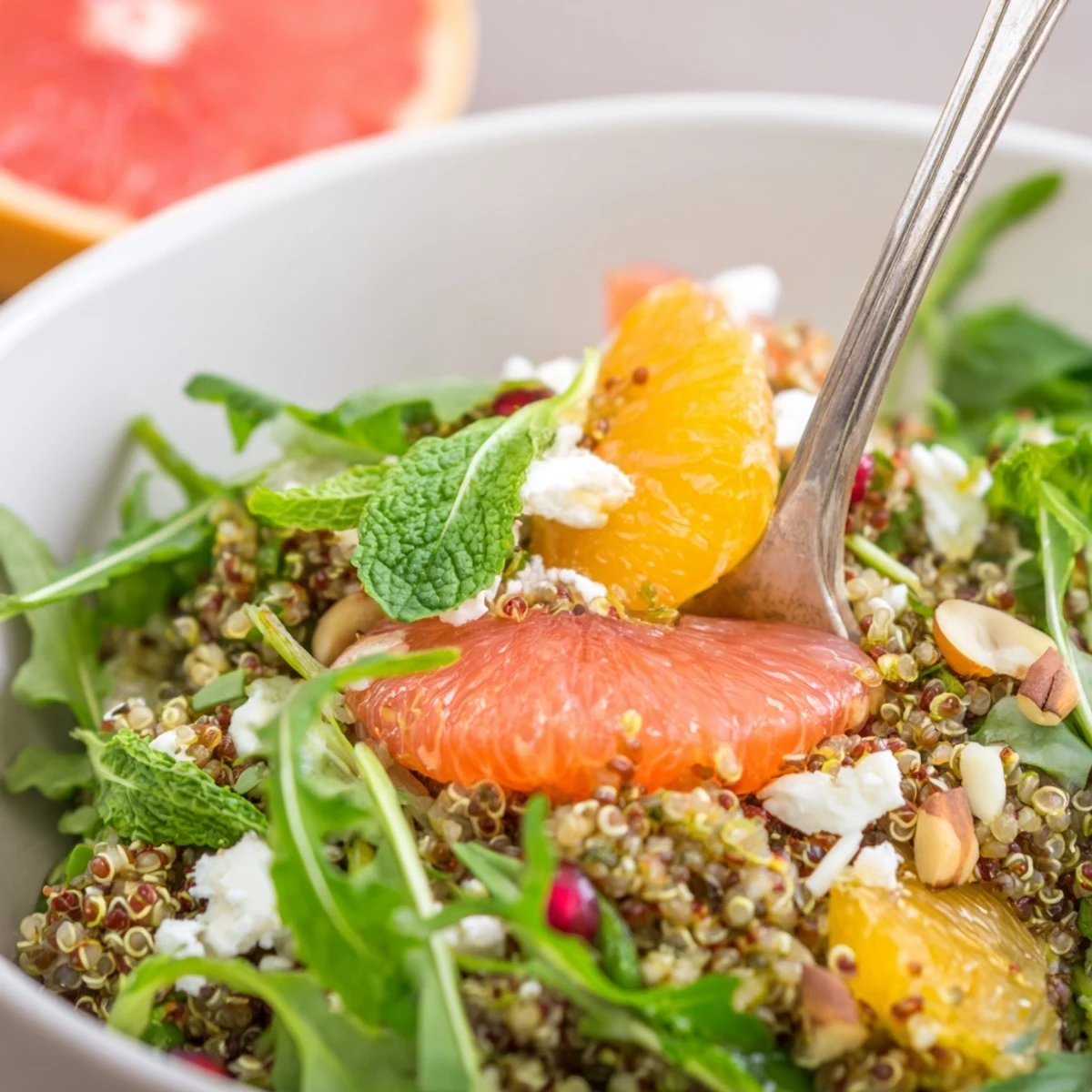 Bright Citrus Herb Quinoa and Arugula Bowl dressed in herb citrus vinaigrette