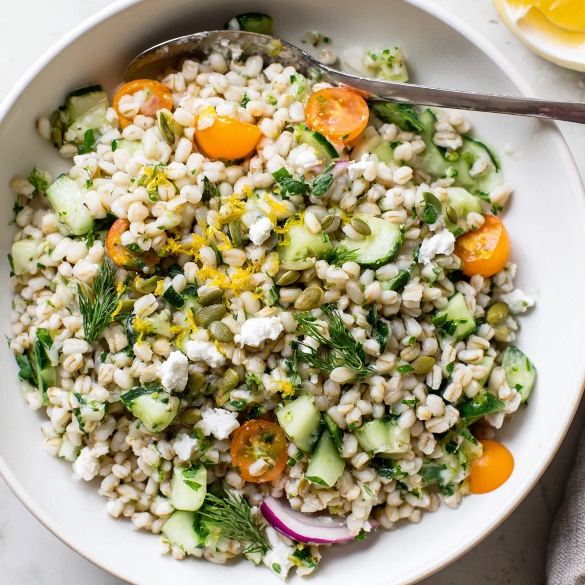 Citrus Herb Barley and Cucumber Bowl with zesty dressing, crisp cucumbers.