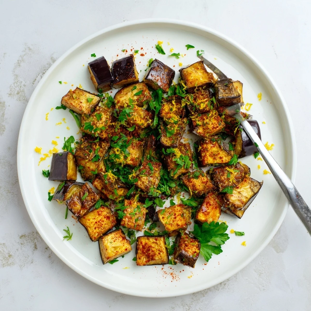 Tender Mediterranean style eggplant cubes seasoned with smoked paprika and cumin roasted until perfectly caramelized