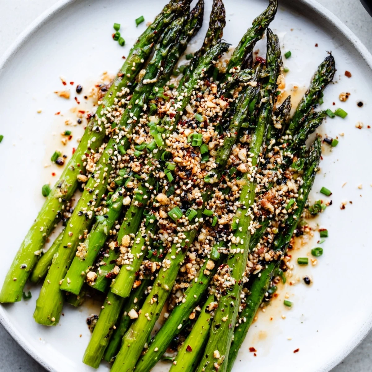 Warm spears tossed in olive oil, chives, lemon, Roasted Asparagus With Toasted Sesame Crunch