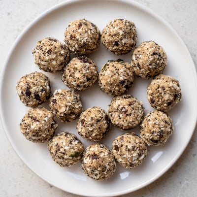 A close-up of Vanilla Almond Oat Energy Bites with chocolate chips, ideal for a quick snack.